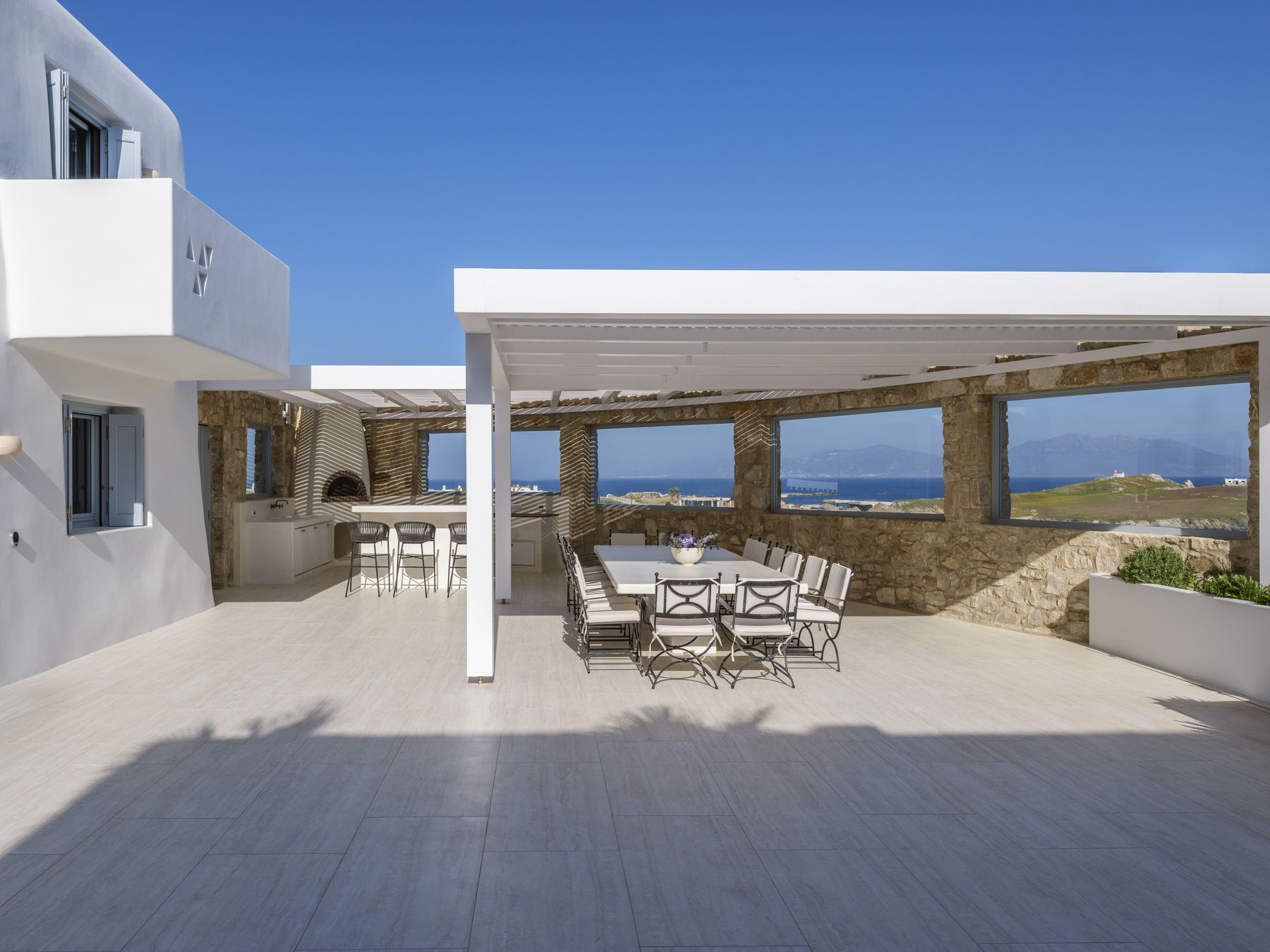 Pergola and dining area next to the house