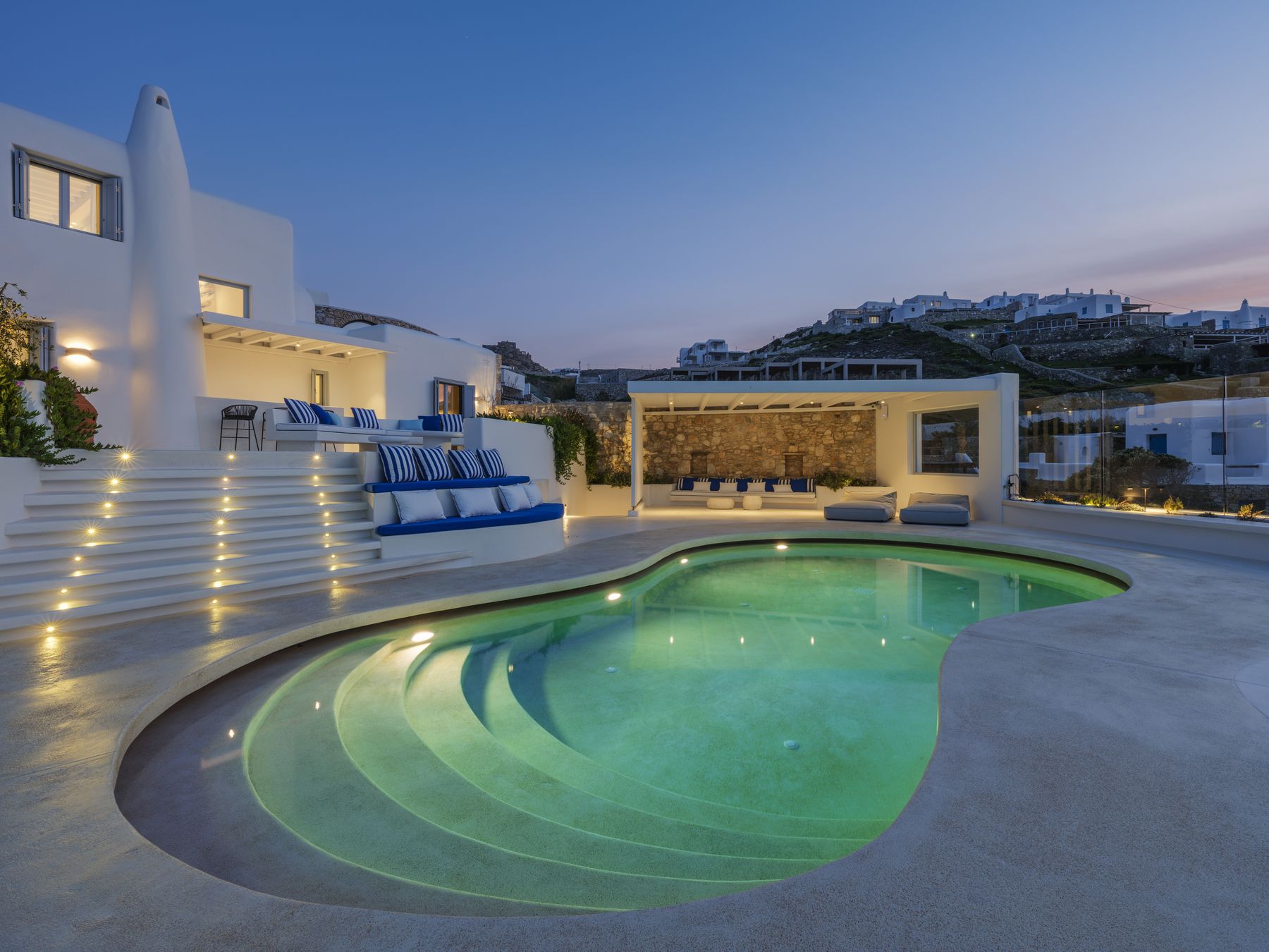 Lit pool steps at dusk