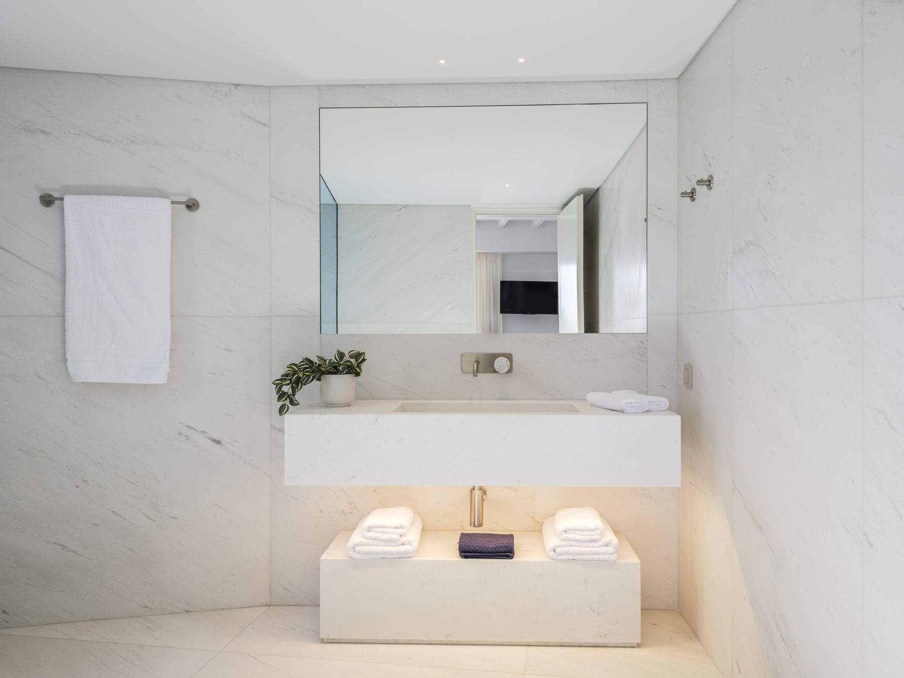 Marble ensuite bathroom with double vanity